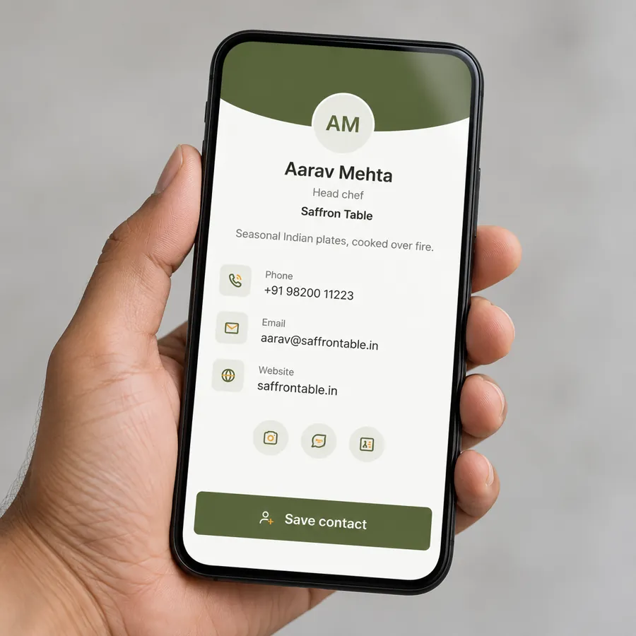 A hand holding a phone that shows a digital business card page with a Save contact button